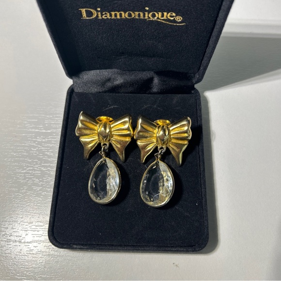 Jil Bari Jewelry - Vintage Jil Bari Gold Tone Bow With Dangling Clear Rhinestones Clip Earrings